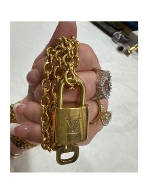 Authentic Louis Vuitton Padlock Pendant with unbranded stainless steel chain 18”